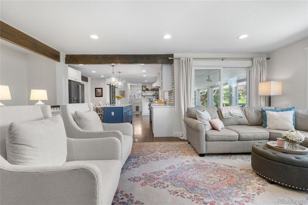 Chandelier, Dining room, Interior, Kitchen, Living room, Pendant Lights, Recessed Lighting, Stainless Steel Appliances, Wood Texture Flooring