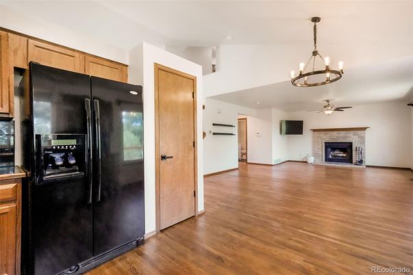 Chandelier, Empty room, Fireplace, Interior, Kitchen, Wood Texture Flooring