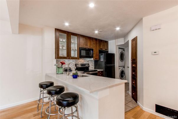 Interior, Kitchen, Recessed Lighting, Washer, Wood Texture Flooring