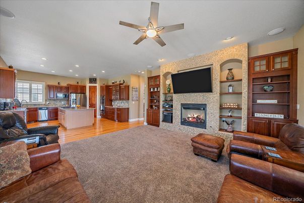 Fireplace, Interior, Kitchen, Living room, Recessed Lighting, Stainless Steel Appliances, Stone Walls, Wood Texture Flooring