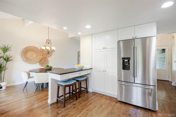 Chandelier, Dining room, Interior, Kitchen, Recessed Lighting, Stainless Steel Appliances, Wood Texture Flooring