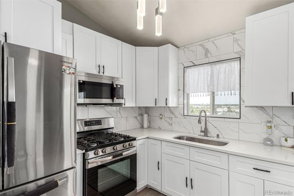 Interior, Kitchen, Marble Walls, Stainless Steel Appliances, Wood Texture Flooring