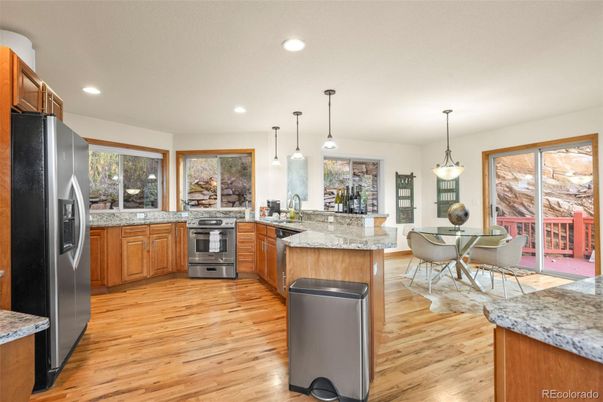 Dining room, Interior, Kitchen, Pendant Lights, Recessed Lighting, Stainless Steel Appliances, Wood Texture Flooring