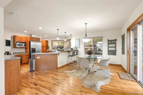 Dining room, Interior, Kitchen, Pendant Lights, Recessed Lighting, Stainless Steel Appliances, Wood Texture Flooring