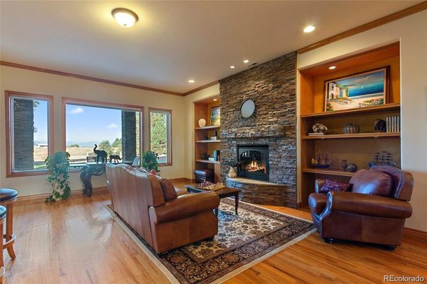 Fireplace, Interior, Living room, Recessed Lighting, Stone Walls, Wood Texture Flooring