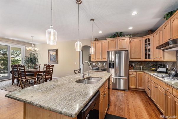 Chandelier, Dining room, Interior, Kitchen, Pendant Lights, Recessed Lighting, Stainless Steel Appliances, Wood Texture Flooring