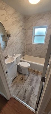 Bathroom, Dual Sink Vanities, Interior, Marble Walls, Wood Texture Flooring