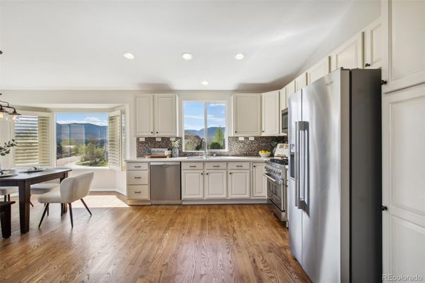 Dining room, Interior, Kitchen, Recessed Lighting, Stainless Steel Appliances, Wood Texture Flooring