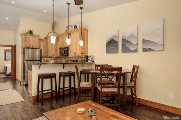 Dining room, Interior, Kitchen, Pendant Lights, Recessed Lighting, Stainless Steel Appliances, Wood Texture Flooring