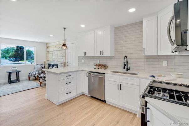 Fireplace, Interior, Kitchen, Pendant Lights, Recessed Lighting, Stainless Steel Appliances, Wood Texture Flooring