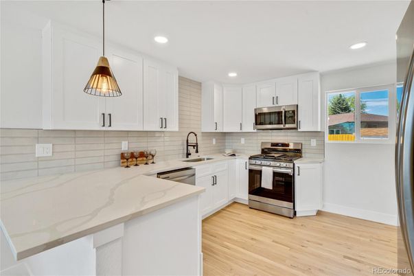 Interior, Kitchen, Pendant Lights, Recessed Lighting, Stainless Steel Appliances, Wood Texture Flooring
