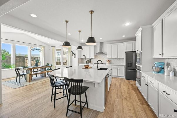 Dining room, Interior, Kitchen, Pendant Lights, Recessed Lighting, Stainless Steel Appliances, Wood Texture Flooring