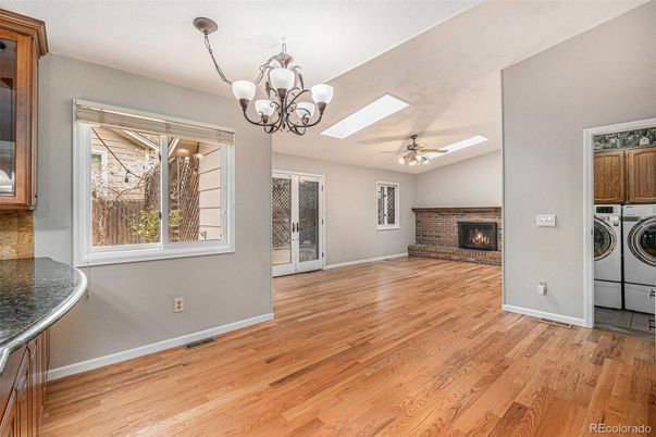 Chandelier, Empty room, Fireplace, Interior, Washer, Wood Texture Flooring