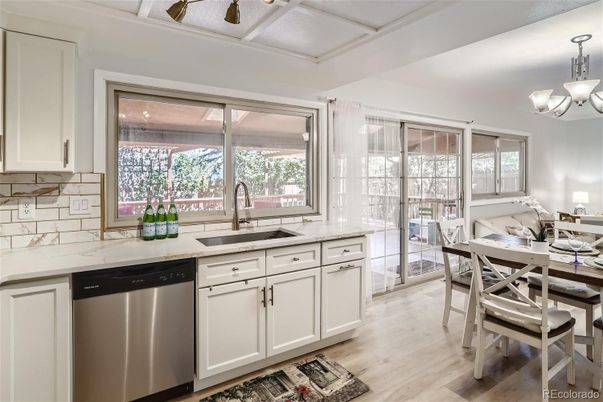 Chandelier, Dining room, Interior, Kitchen, Stainless Steel Appliances, Wood Texture Flooring