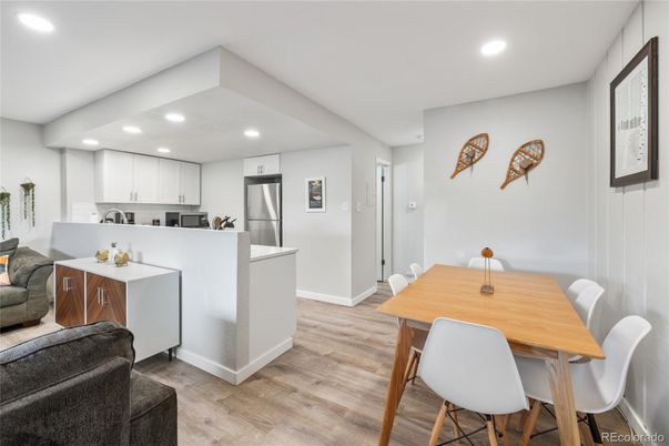 Dining room, Interior, Kitchen, Recessed Lighting, Stainless Steel Appliances, Wood Texture Flooring