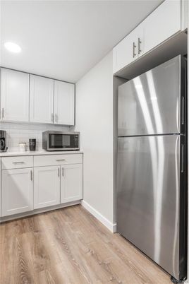 Interior, Kitchen, Recessed Lighting, Stainless Steel Appliances, Wood Texture Flooring