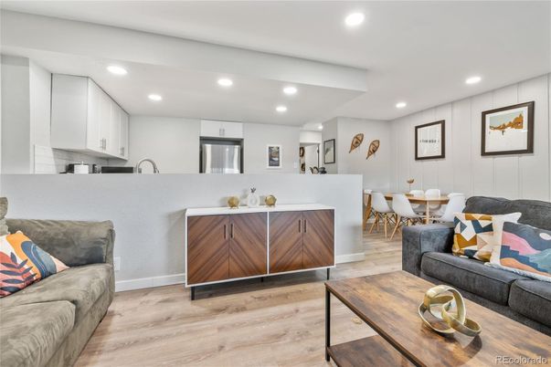 Dining room, Interior, Kitchen, Living room, Recessed Lighting, Stainless Steel Appliances, Wood Texture Flooring