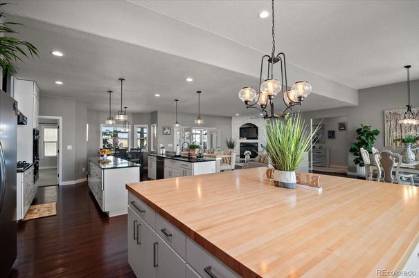 Chandelier, Dining room, Interior, Kitchen, Pendant Lights, Recessed Lighting, Stainless Steel Appliances, Wood Texture Flooring