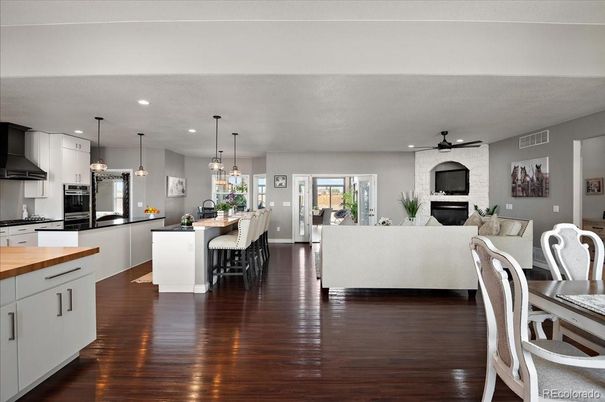 Dining room, Fireplace, Interior, Kitchen, Living room, Pendant Lights, Recessed Lighting, Stainless Steel Appliances, Stone Walls, Wood Texture Flooring
