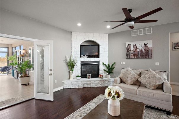 Fireplace, Interior, Living room, Recessed Lighting, Stone Walls, Wood Texture Flooring