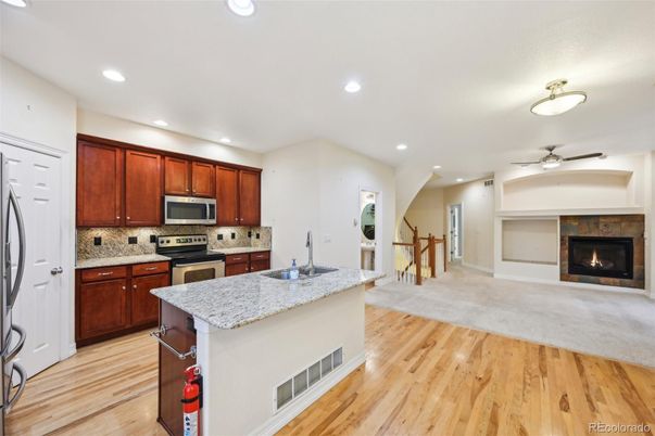 Fireplace, Interior, Kitchen, Recessed Lighting, Wood Texture Flooring