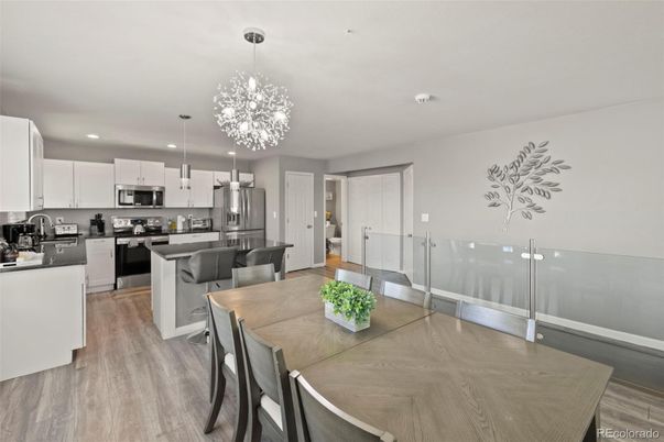 Chandelier, Dining room, Interior, Kitchen, Pendant Lights, Recessed Lighting, Stainless Steel Appliances, Wood Texture Flooring