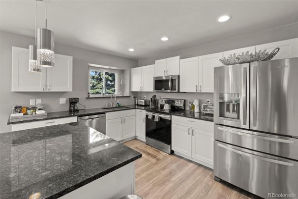 Interior, Kitchen, Pendant Lights, Recessed Lighting, Stainless Steel Appliances, Wood Texture Flooring