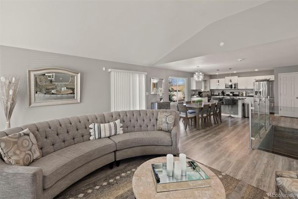 Chandelier, Dining room, Interior, Kitchen, Living room, Pendant Lights, Recessed Lighting, Stainless Steel Appliances, Wood Texture Flooring