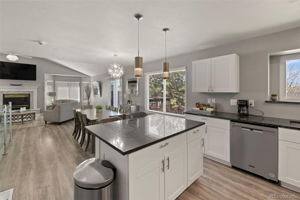 Chandelier, Dining room, Fireplace, Interior, Kitchen, Living room, Pendant Lights, Wood Texture Flooring