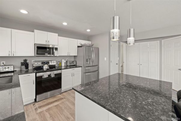 Interior, Kitchen, Pendant Lights, Recessed Lighting, Stainless Steel Appliances, Wood Texture Flooring