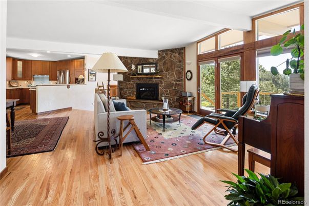 Fireplace, Interior, Kitchen, Living room, Recessed Lighting, Stone Walls, Wood Texture Flooring