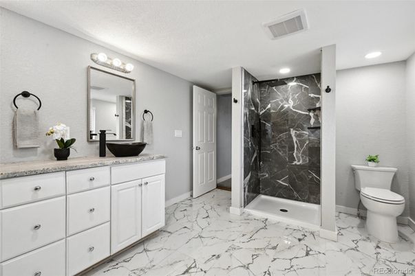 Bathroom, Dual Sink Vanities, Glass Shower, Interior, Marble, Marble Walls, Recessed Lighting