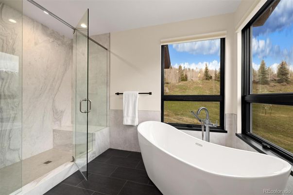 Bathroom, Free Standing Baths, Glass Shower, Interior, Marble Walls, Recessed Lighting
