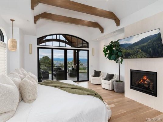 Bedroom, Fireplace, Interior, Pendant Lights, Recessed Lighting, Water, Wooden Beams, Wood Texture Flooring