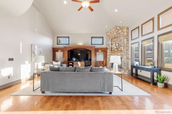 Fireplace, Interior, Living room, Recessed Lighting, Stone Walls, Wood Texture Flooring