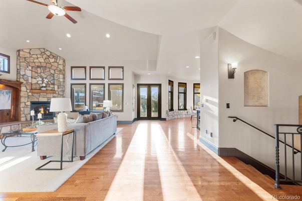 Fireplace, Interior, Living room, Recessed Lighting, Stone Walls, Wood Texture Flooring
