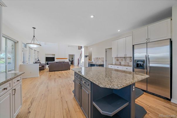 Fireplace, Interior, Kitchen, Living room, Pendant Lights, Recessed Lighting, Stainless Steel Appliances, Wood Texture Flooring
