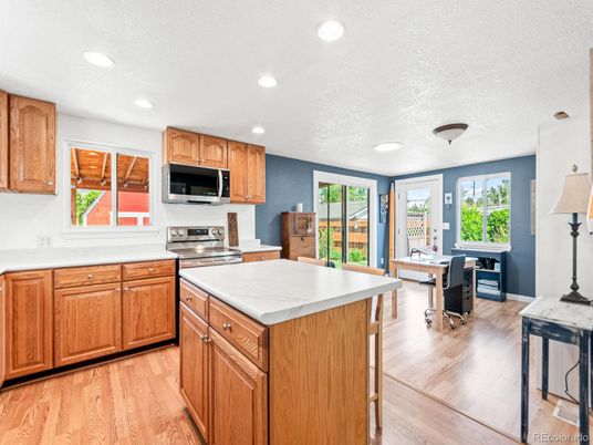 Dining room, Interior, Kitchen, Recessed Lighting, Stainless Steel Appliances, Wood Texture Flooring