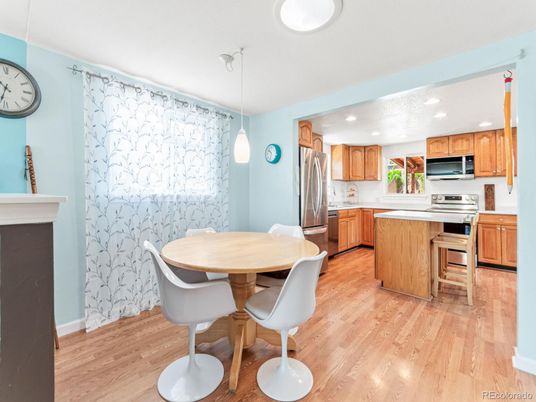 Dining room, Interior, Kitchen, Pendant Lights, Recessed Lighting, Stainless Steel Appliances, Wood Texture Flooring