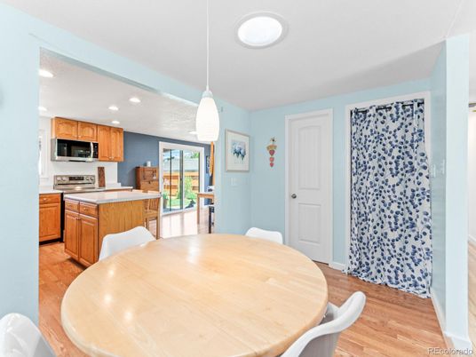 Dining room, Interior, Kitchen, Pendant Lights, Recessed Lighting, Stainless Steel Appliances, Wood Texture Flooring
