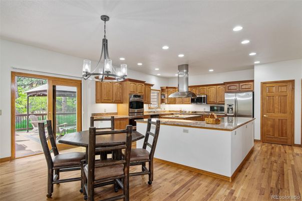 Dining room, Interior, Kitchen, Pendant Lights, Recessed Lighting, Stainless Steel Appliances, Wood Texture Flooring