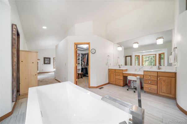 Bathroom, Dual Sink Vanities, Free Standing Baths, Interior, Recessed Lighting, Wood Texture Flooring