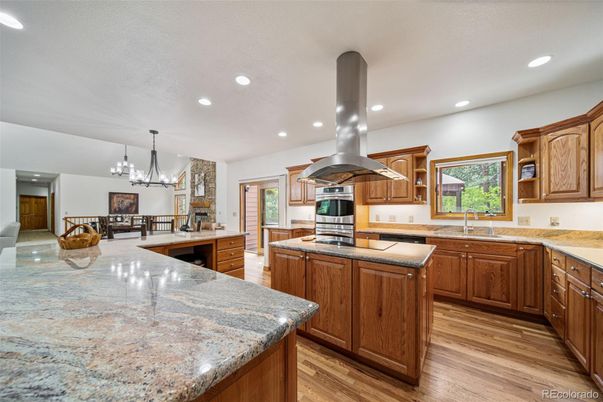 Chandelier, Interior, Kitchen, Pendant Lights, Recessed Lighting, Stainless Steel Appliances, Wood Texture Flooring