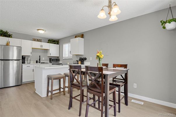 Dining room, Interior, Kitchen, Pendant Lights, Stainless Steel Appliances, Wood Texture Flooring