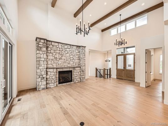 Empty room, Fireplace, Interior, Pendant Lights, Recessed Lighting, Stone Walls, Wooden Beams, Wood Texture Flooring