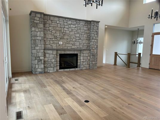 Empty room, Fireplace, Interior, Pendant Lights, Stone Walls, Wood Texture Flooring