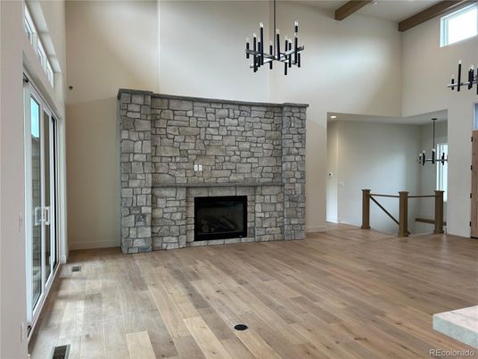 Empty room, Fireplace, Interior, Recessed Lighting, Stone Walls, Wooden Beams, Wood Texture Flooring