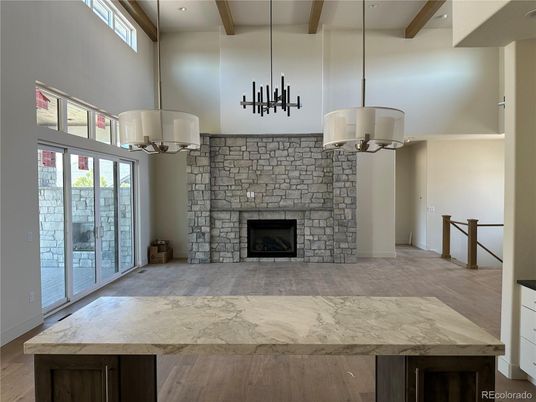 Chandelier, Empty room, Fireplace, Interior, Pendant Lights, Recessed Lighting, Wooden Beams, Wood Texture Flooring