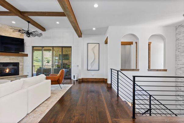 Fireplace, Interior, Living room, Recessed Lighting, Stone Walls, Wooden Beams, Wood Texture Flooring