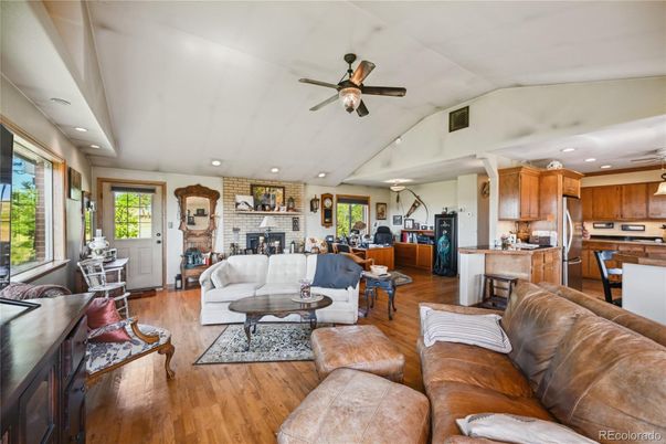 Dining room, Fireplace, Interior, Kitchen, Living room, Recessed Lighting, Stone Walls, Wood Texture Flooring